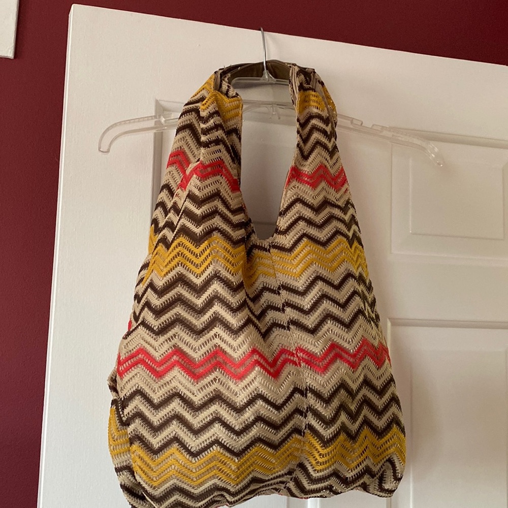 Cool hobo purse with gold red brown and tan chevron design